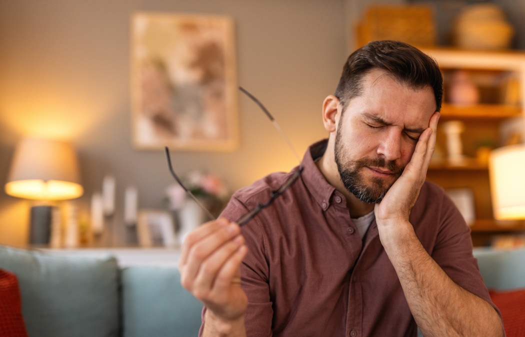 Tooth Pain And Dentistry. Young Man Suffering From Terrible Strong Teeth Pain, Touching Cheek With Hand. Feeling Painful Toothache. Dental Care And Health Concept. High Resolution